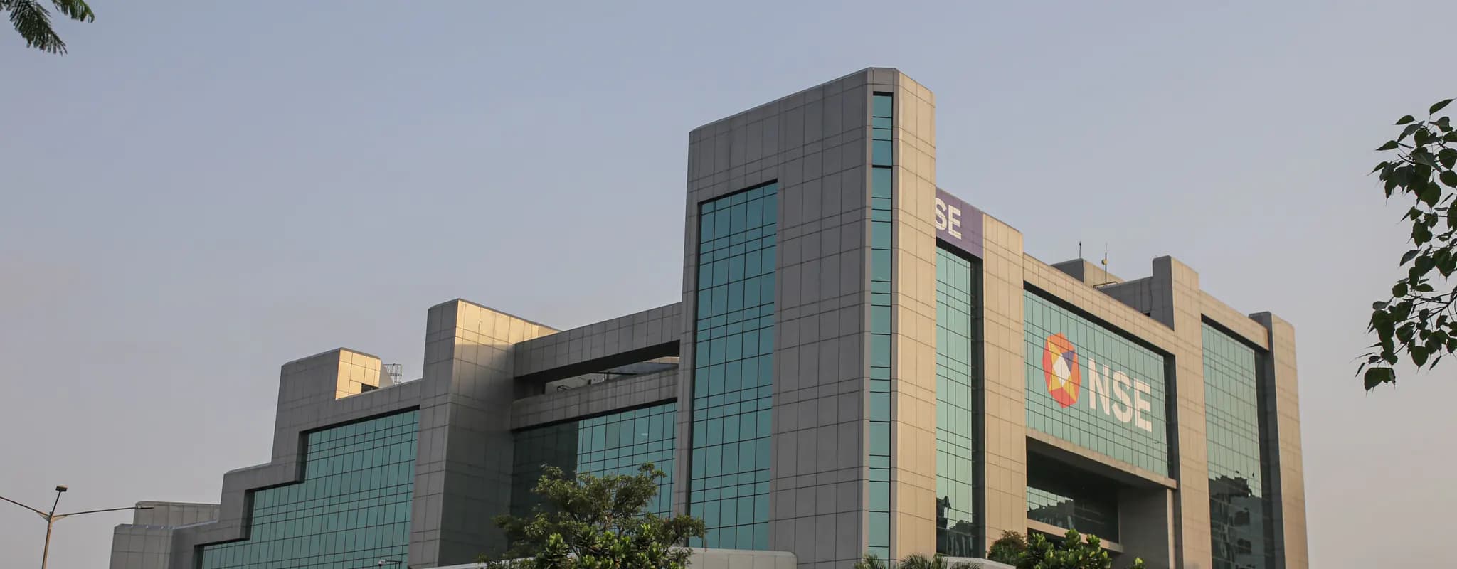 The glass-fronted National Stock Exchange building in Mumbai viewed from the street.