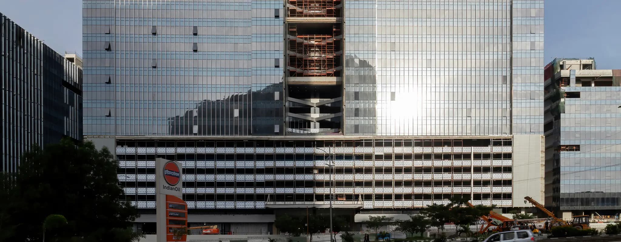 A glass-fronted office building under construction in Hyderabad’s HITEC City.