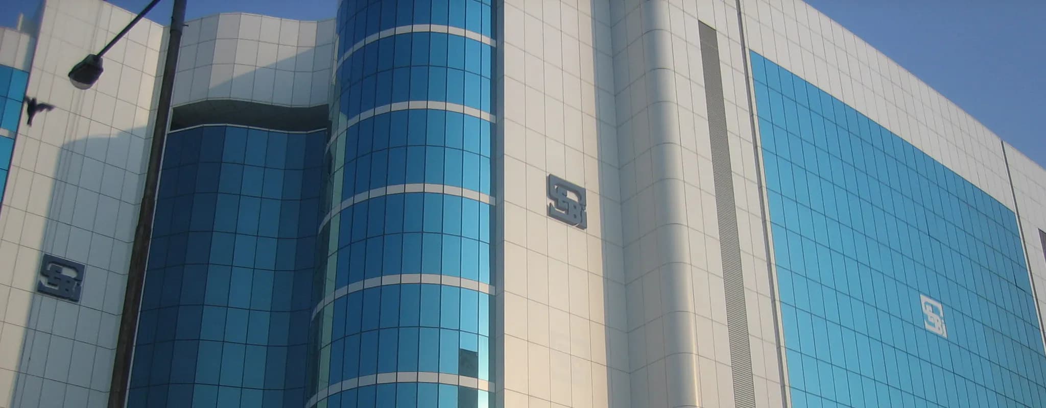 The blue-glass facade of SEBI Bhavan in Mumbai.
